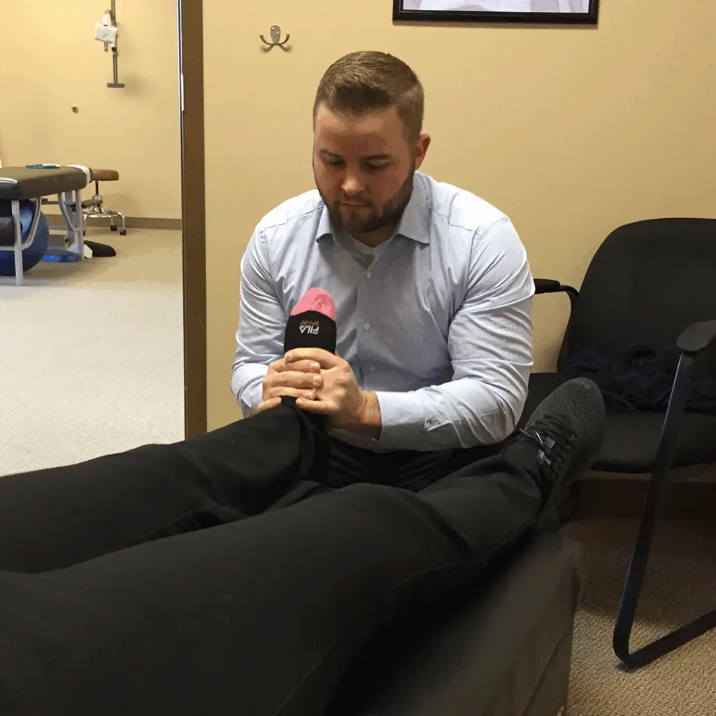 Chiropractic leg and hip stretching treatment for hip pain