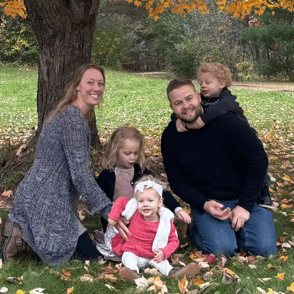 Dr. Andrew Krueger with his family outdoors in Minnesota