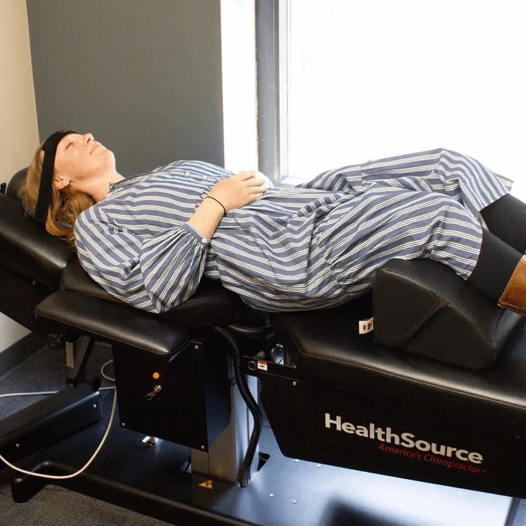 Dr. Andrew Krueger treating a patient's lower back and legs in Shoreview