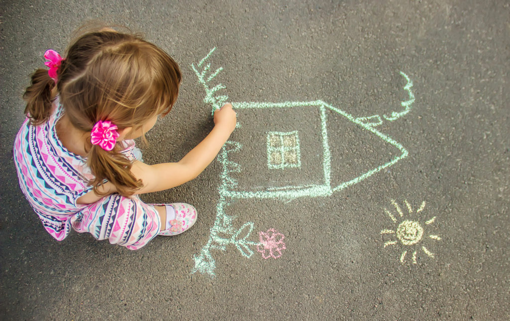 young girl making an art in the patio