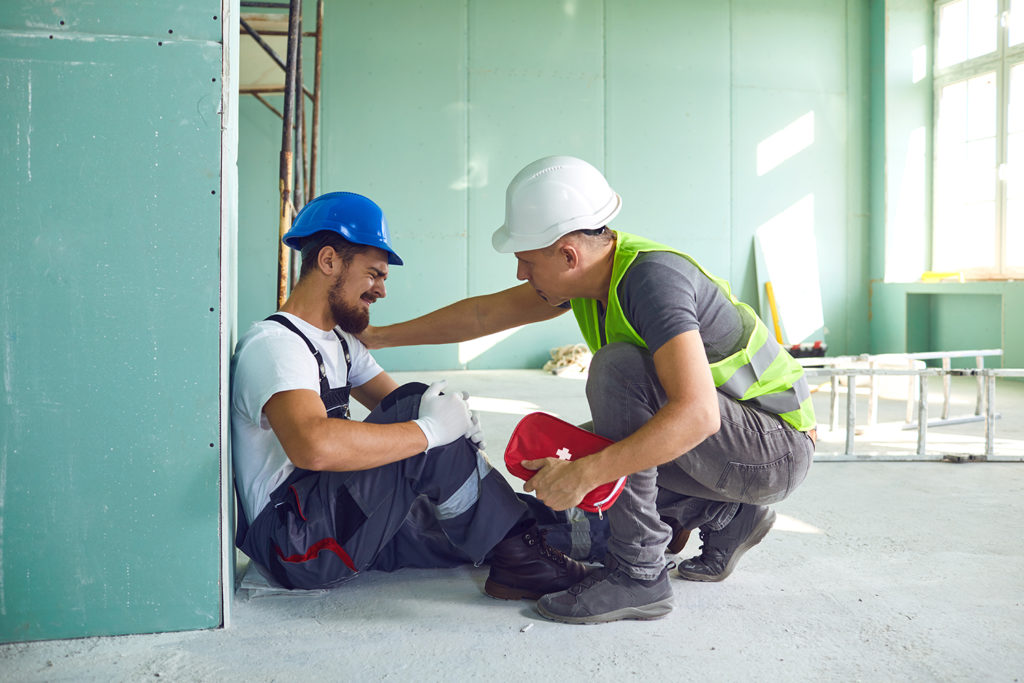 two men in work, one got injured during work hours